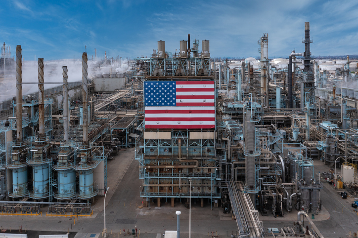 American flag on oil refinery plant.